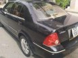 Ford Laser GHIA 1.8 AT 2004 - Cần bán xe Ford Laser GHIA 1.8 AT đời 2004, màu đen chính chủ