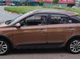 Hyundai i20 Active 1.4 AT 2015 - Cần bán Hyundai i20 Active 1.4 AT sản xuất 2015, màu nâu, xe nhập 