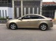 Chevrolet Cruze 2010 - Gia đình cần bán Cruze 2010, số sàn, màu vàng cát