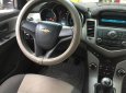 Chevrolet Cruze 2010 - Gia đình cần bán Cruze 2010, số sàn, màu vàng cát