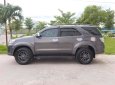 Toyota Fortuner 2014 - Gia đình cần bán chiếc Fortuner 2014, máy xăng, số tự động, màu xám chì