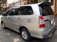 Toyota Innova E 2014 - Nhà cần bán Toyota Innova E 2014 số sàn màu bạc