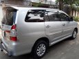 Toyota Innova E 2014 - Nhà cần bán Toyota Innova E 2014 số sàn màu bạc