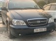 Kia Carnival LS 2.5 AT 2009 - Bán Kia Carnival LS 2.5 AT đời 2009, màu đen, số tự động