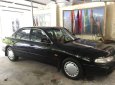 Mazda 626 1996 - Cần bán Mazda 626 sản xuất 1996, màu đen xe gia đình, 70 triệu