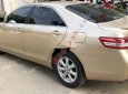 Toyota Camry 2010 - Cần bán gấp Toyota Camry sản xuất 2010, màu vàng