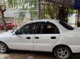 Daewoo Lanos SX 2002 - Cần bán gấp Daewoo Lanos SX đời 2002, màu trắng số sàn