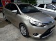 Toyota Vios   2015 - Bán lại xe Toyota Vios năm 2015, màu vàng cát