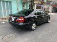 Toyota Camry 2003 - Cần bán gấp Toyota Camry đời 2003, màu đen số sàn, 258tr