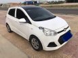 Hyundai Grand i10    MT 2014 - Cần bán Hyundai Grand i10 MT sản xuất 2014, màu trắng, nhập khẩu xe gia đình