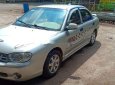 Kia Spectra 2004 - Cần bán gấp Kia Spectra 2004, màu bạc xe nguyên bản