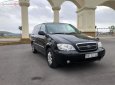 Kia Carnival 2.4 2009 - Bán Kia Carnival 2.4 sản xuất năm 2009, màu đen xe gia đình, 245tr