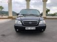 Kia Carnival 2.4 2009 - Bán Kia Carnival 2.4 sản xuất năm 2009, màu đen xe gia đình, 245tr