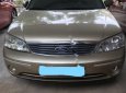 Ford Laser 2003 - Cần bán xe Ford Laser năm 2003, màu vàng số tự động