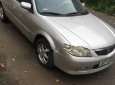 Mazda 323 2003 - Cần bán Mazda 323 MT sản xuất 2003, màu bạc chính chủ