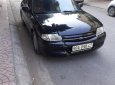 Ford Laser 2000 - Bán ô tô Ford Laser sản xuất năm 2000, màu đen xe còn mới