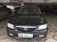 Mazda 323 2003 - Cần bán lại xe Mazda 323 đời 2003, màu đen xe còn chạy êm