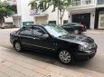 Ford Laser   2004 - Bán Ford Laser GHIA 1.8 AT sản xuất 2004, màu đen, số tự động 