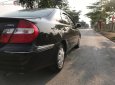 Toyota Camry 2.4G 2002 - Bán Toyota Camry 2.4G năm sản xuất 2002, màu đen số sàn 