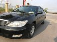 Toyota Camry 2.4G 2002 - Bán Toyota Camry 2.4G năm sản xuất 2002, màu đen số sàn 