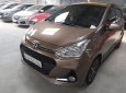 Hyundai Grand i10 2017 - Bán xe Hyundai Grand i10 sản xuất năm 2017, màu nâu, 375tr xe còn mới