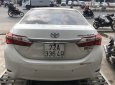 Toyota Corolla 2015 - Cần bán gấp Toyota Corolla sản xuất năm 2015, màu trắng số tự động, 570 triệu