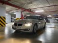 BMW 3 Series   2014 - Cần bán lại xe BMW 320i sản xuất 2014, màu trắng, xe nhập, giá 750tr