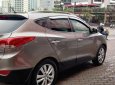 Hyundai Tucson 2.0  2011 - Cần bán xe Hyundai Tucson 2.0 AT 4WD 2011, màu ghi