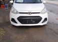 Hyundai Grand i10     2014 - Cần bán Hyundai Grand i10 sản xuất 2014, màu trắng, xe nhập chính chủ, giá tốt