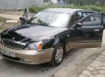 Daewoo Magnus   2004 - Cần bán Daewoo Magnus sản xuất 2004, màu đen, nhập khẩu nguyên chiếc 