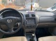 Mazda 323F 2004 - Cần bán gấp Mazda 323F GLX đời 2004, màu trắng