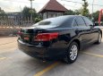 Toyota Camry 2010 - Bán xe Toyota Camry 2.4G sản xuất 2010, màu đen, số tự động