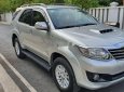 Toyota Fortuner 2014 - Cần bán gấp Toyota Fortuner MT năm 2014, màu bạc như mới