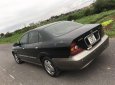 Daewoo Magnus 2004 - Cần bán xe Daewoo Magnus đời 2004, màu đen giá cạnh tranh