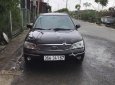 Ford Laser   2003 - Bán Ford Laser GHIA 1.8 MT sản xuất năm 2003, màu đen, 134 triệu