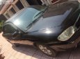 Kia Spectra   2004 - Cần bán Kia Spectra 1.6 MT đời 2004, màu đen, số sàn