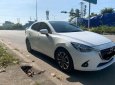 Mazda 2 2015 - Cần bán gấp Mazda 2 đời 2015, màu trắng, xe nhập chính chủ