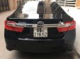 Toyota Camry 2014 - Cần bán gấp Toyota Camry 2.0E năm 2014, màu đen, 670tr