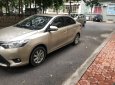 Toyota Vios E 2015 - Cần bán gấp Toyota Vios E đời 2015, màu vàng, ít sử dụng