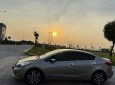 Kia K3   1.6 MT  2014 - Bán ô tô Kia K3 1.6 MT năm 2014, màu vàng cát, 350tr