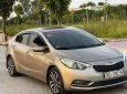 Kia K3   1.6 MT  2014 - Bán ô tô Kia K3 1.6 MT năm 2014, màu vàng cát, 350tr