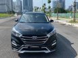 Hyundai Tucson 2017 - Cần bán xe Hyundai Tucson sản xuất 2017, màu đen, giá chỉ 705 triệu