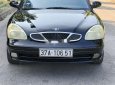 Daewoo Nubira 2003 - Cần bán lại xe Daewoo Nubira năm 2003, màu đen xe gia đình, giá 65tr