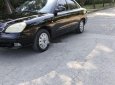 Daewoo Nubira 2003 - Cần bán lại xe Daewoo Nubira năm 2003, màu đen xe gia đình, giá 65tr