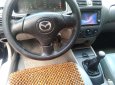 Mazda 323 2004 - Bán ô tô Mazda 323 2004, màu đen