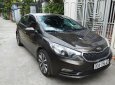 Kia K3   1.6 MT  2014 - Bán Kia K3 1.6 MT đời 2014, màu nâu còn mới