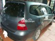 Nissan Livina  1.8 MT 2011 - Bán Nissan Livina 1.8 MT 2011, màu xanh lục xe gia đình