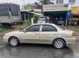 Kia Spectra   1.6 MT  2004 - Xe Kia Spectra 1.6 MT sản xuất năm 2004, màu vàng còn mới, 90 triệu