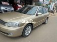 Ford Laser     2002 - Cần bán gấp Ford Laser đời 2002, màu vàng còn mới, giá 145tr