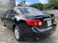 Toyota Corolla 1.8MT 2009 - Bán Toyota Corolla 1.8MT đời 2009, màu đen còn mới